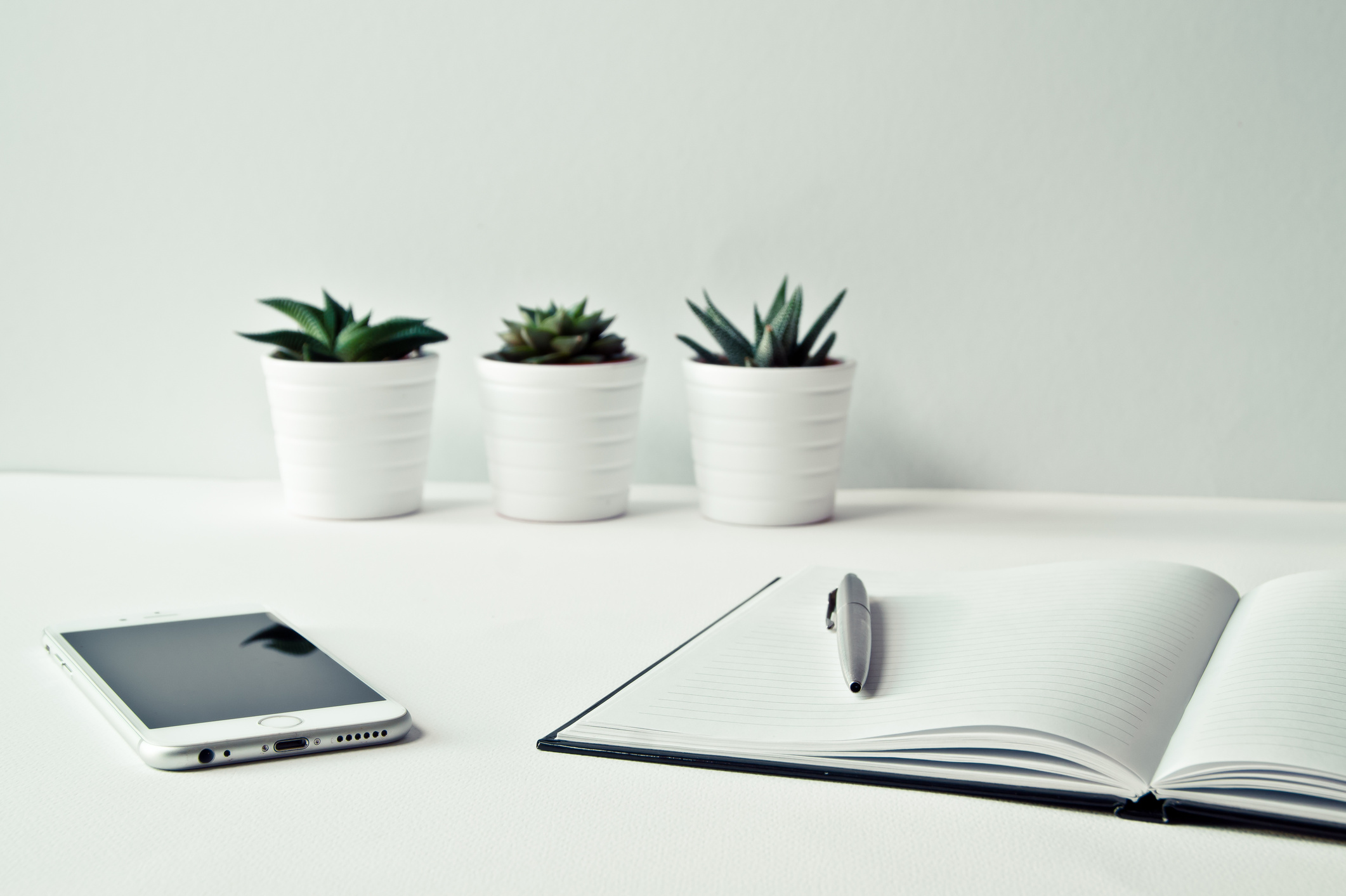 Desk with Notebook and Mobile Phone